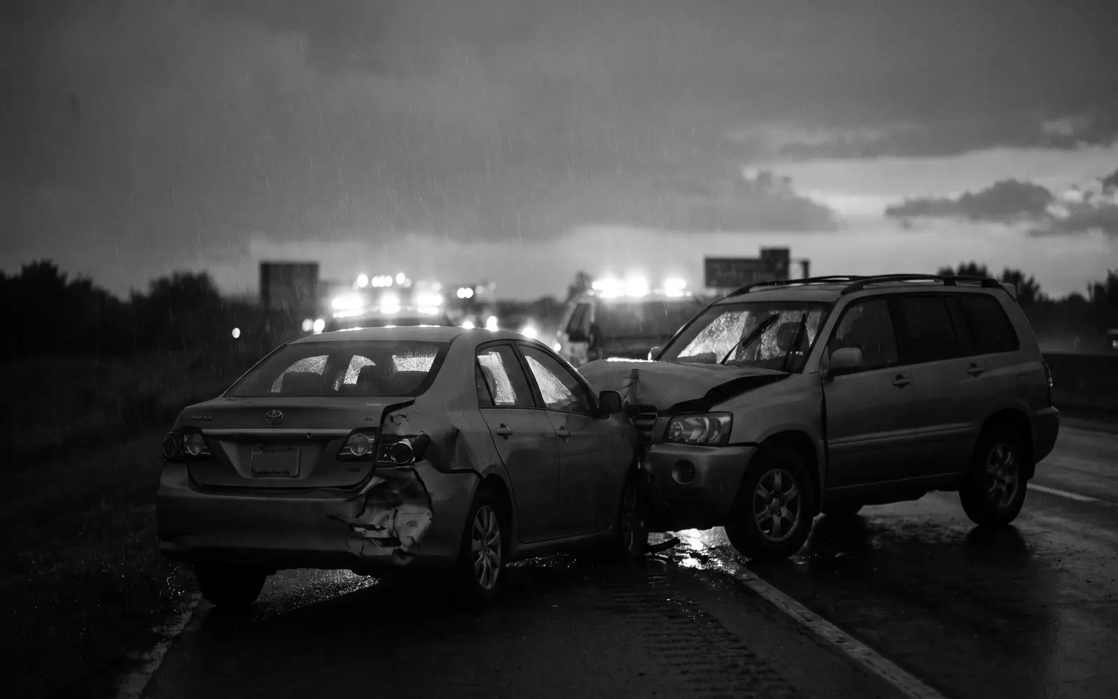Aftermath of a rear-end collision on a freeway at dusk